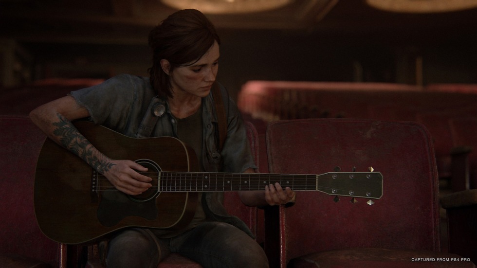 Ellie playing the guitar in The Last of Us Part II